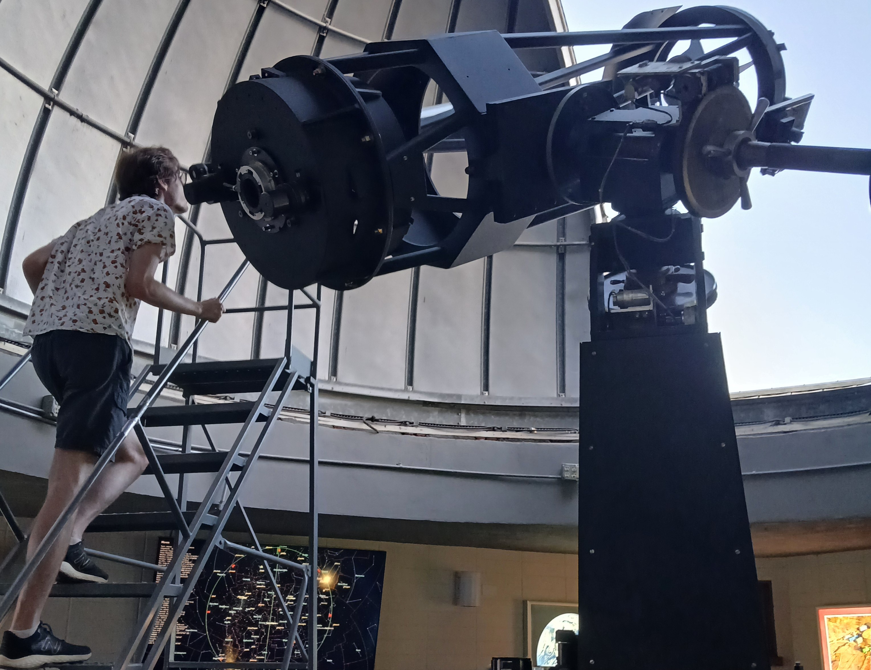 Grant Henderson looking through a telescope